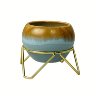 Pot with stand for indoor plants.